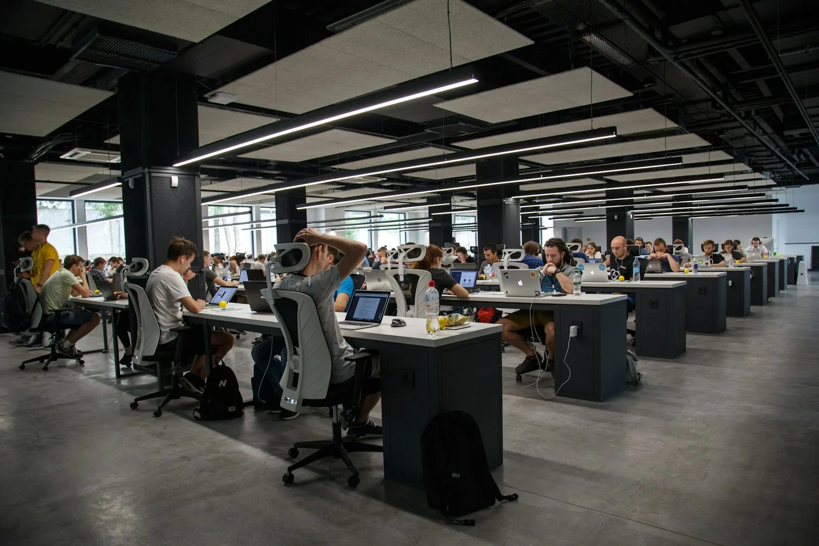 A large open-plan office full of people working at desks